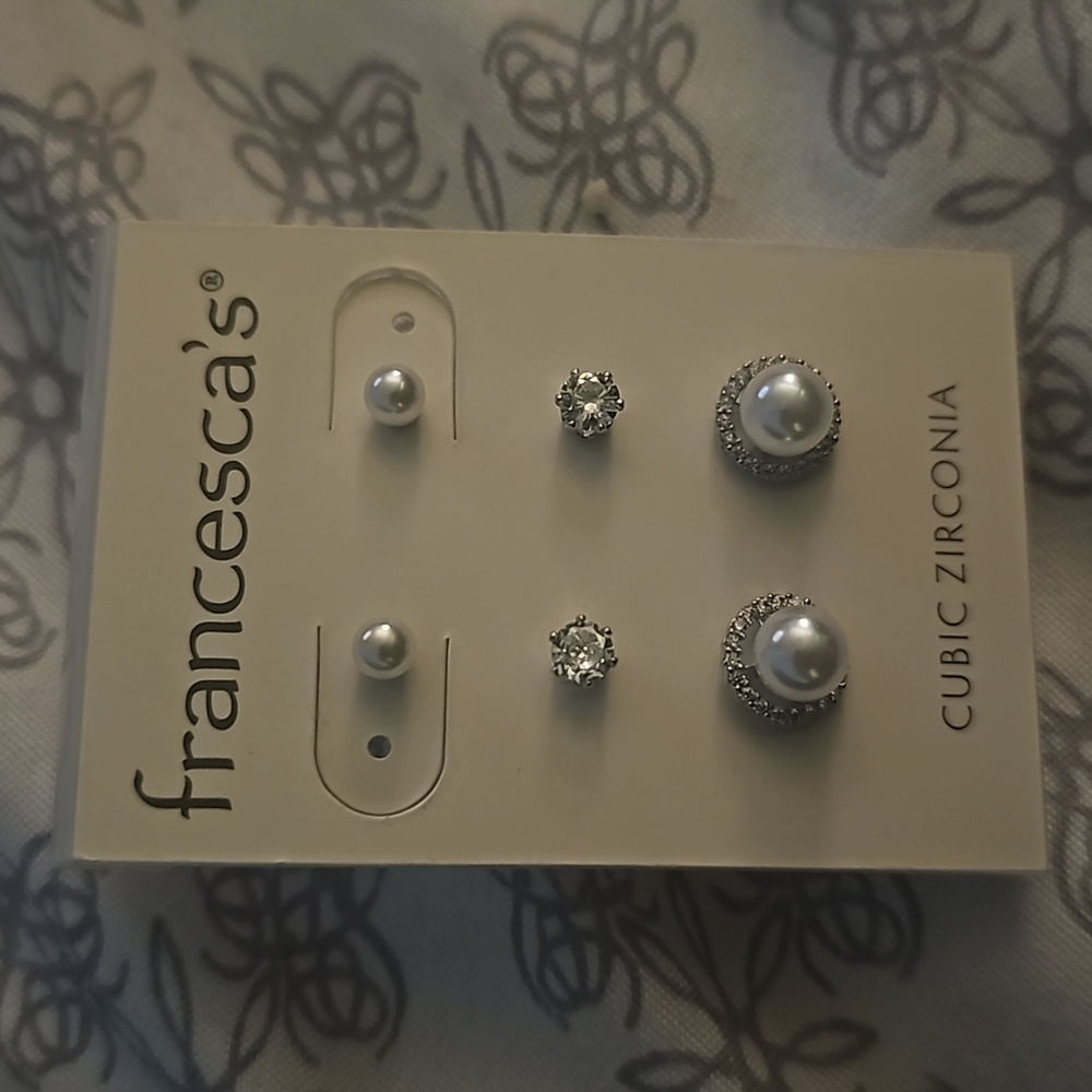 Set of three silver stud earrings